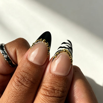 Bold almond press on nails, nude pink French tips, leopard print, gold bead chain and metal band