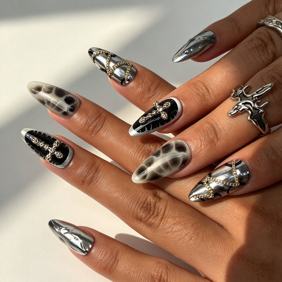 Model hand wearing Noir Star almond Y2K gothic reusable press on nails