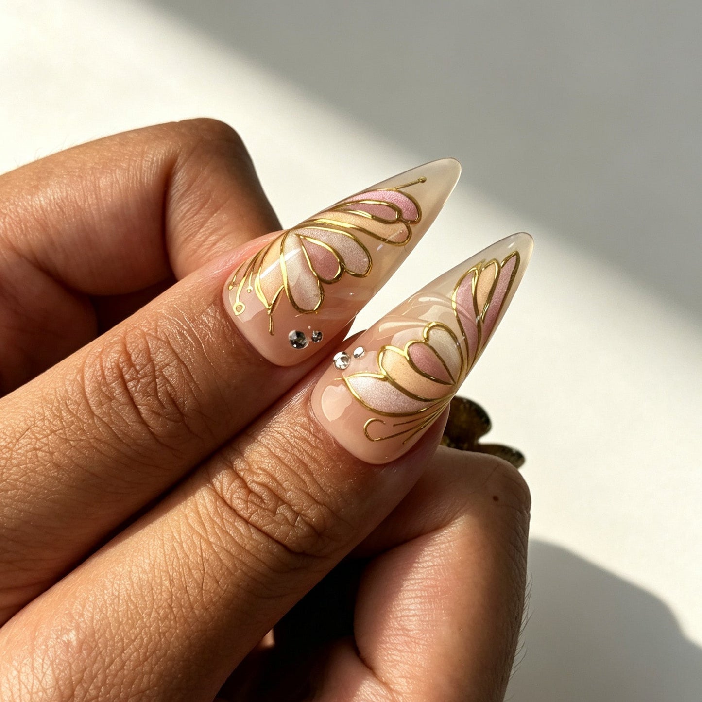 Soft nude peachy stiletto press‑on nails real hand manicure