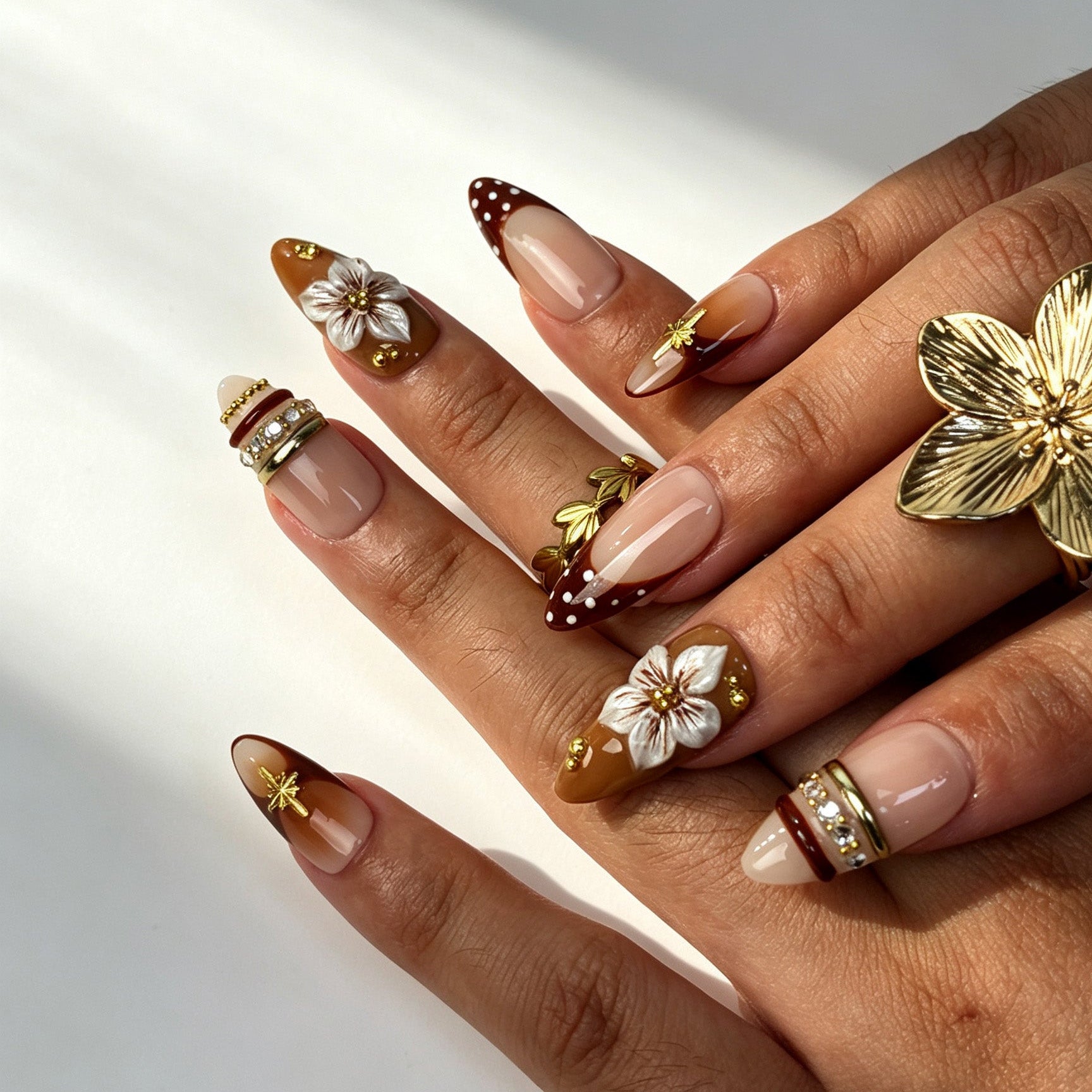 Handmade brown floral press-on nails with 3D flower and polka dot french tips