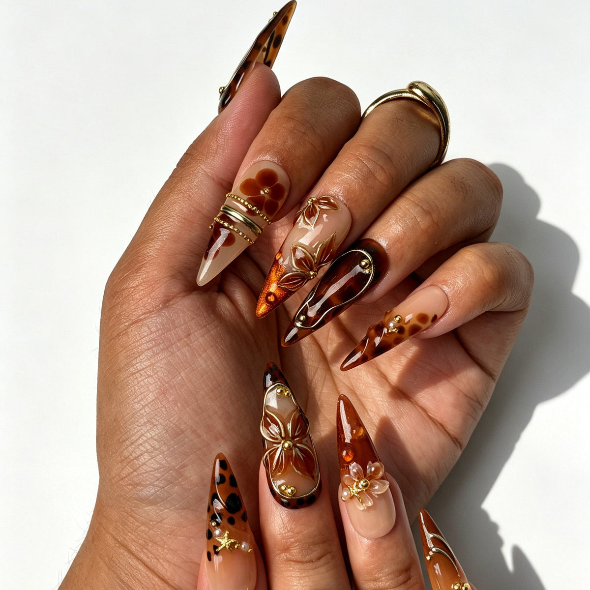 Handcrafted stiletto press on nails, golden amber design for autumn styling, evening events and parties