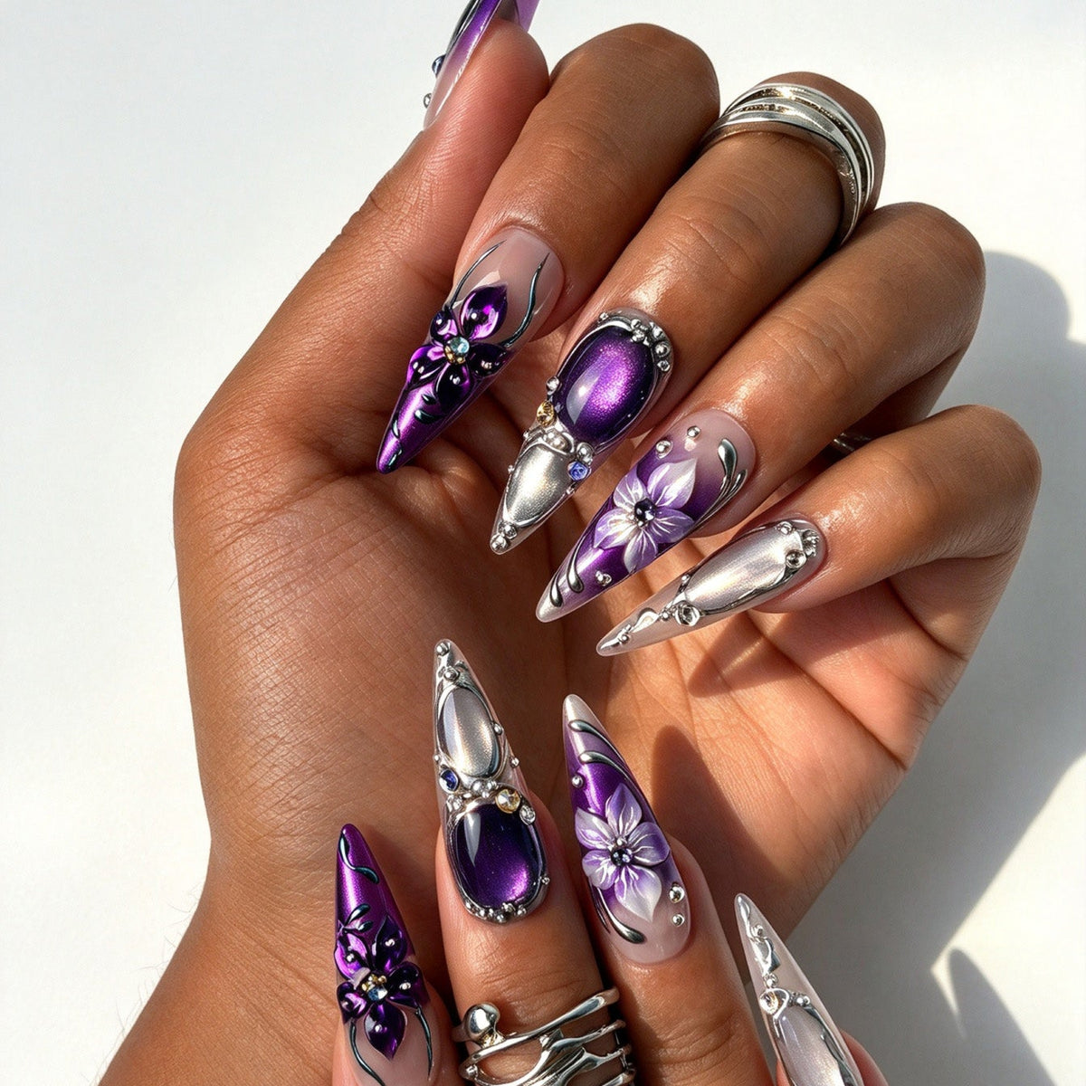 Long stiletto false nails, mysterious purple gradient 3D metallic flower gothic nail design