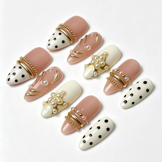 Blush Dot spring fake nail set, nude cream base, classic black polka dot print, pearl and gold line embellishments