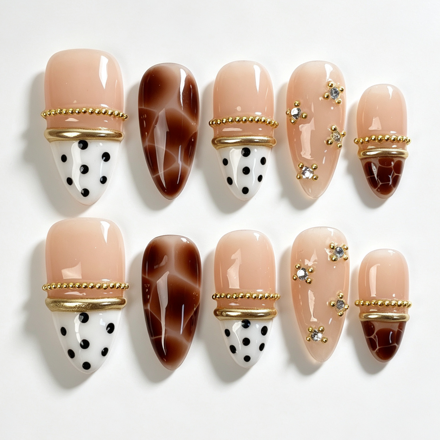 Mocha Vein medium almond press on nails, sheer nude mocha brown gradient tip, black polka dot, pink butterfly, gold bead and pearl chain decor