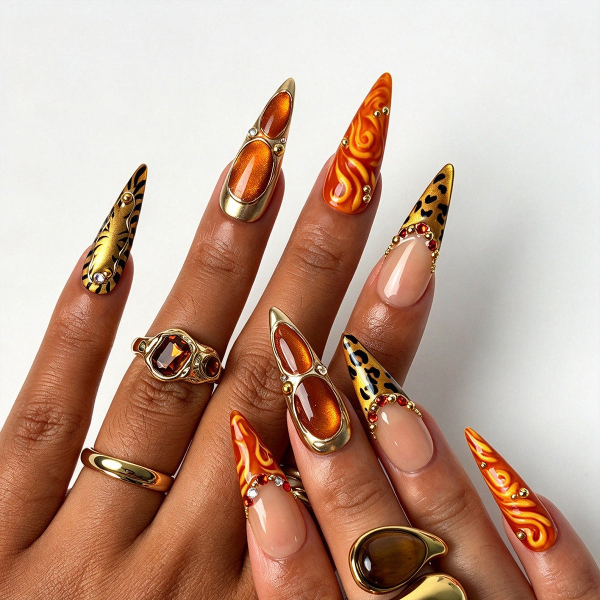 Long stiletto false nails, wild autumn tiger leopard print with gold studs and red crystal rhinestones