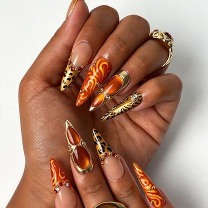 Handcrafted stiletto press on nails, bold safari orange flame nail design for party and night out